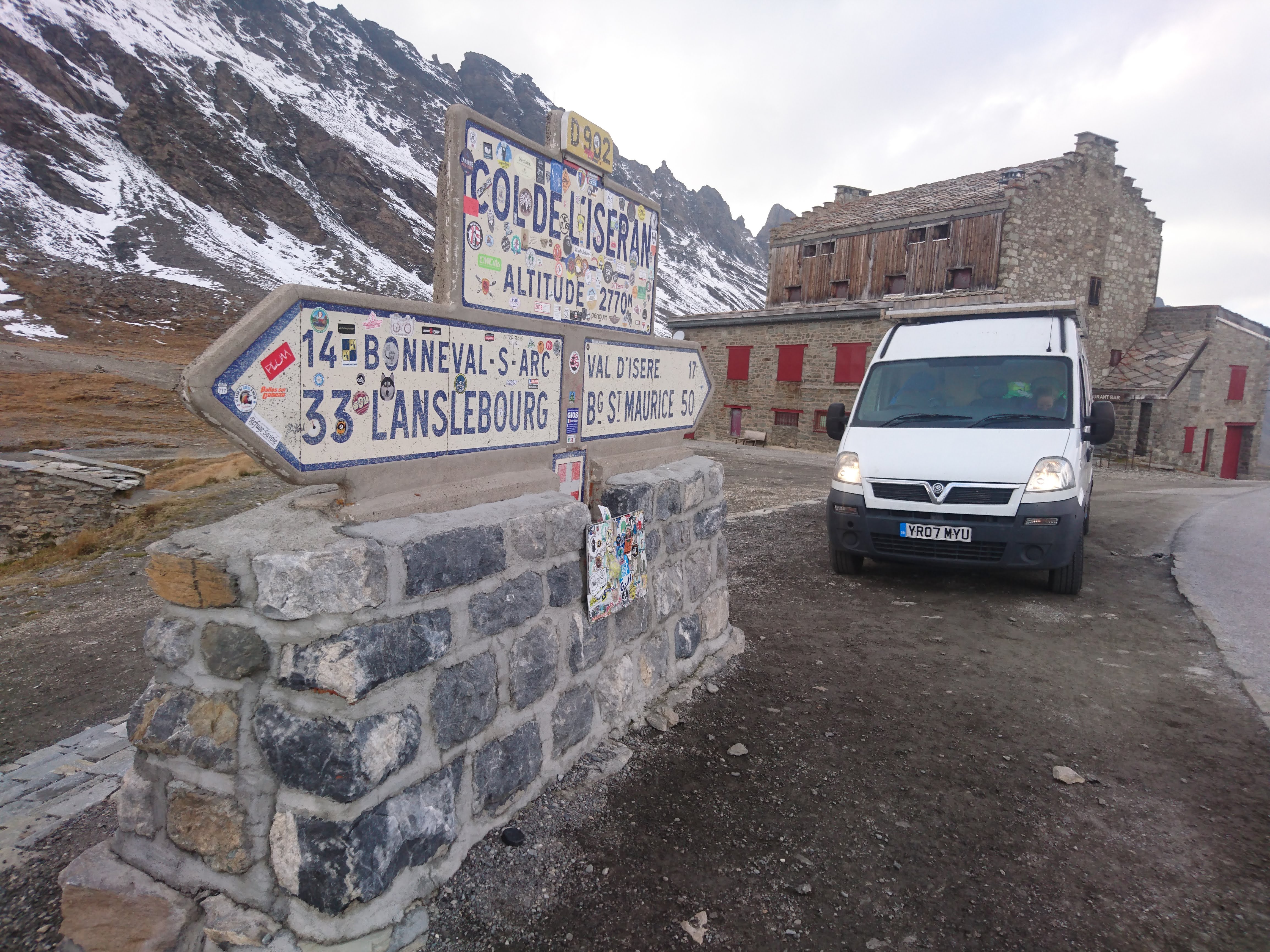 MewMew Campervan parked near the sign at Col de l'Iseran (el. 2,764 metres (9,068 ft)) is a mountain pass in France, the highest paved pass in the Alps. 